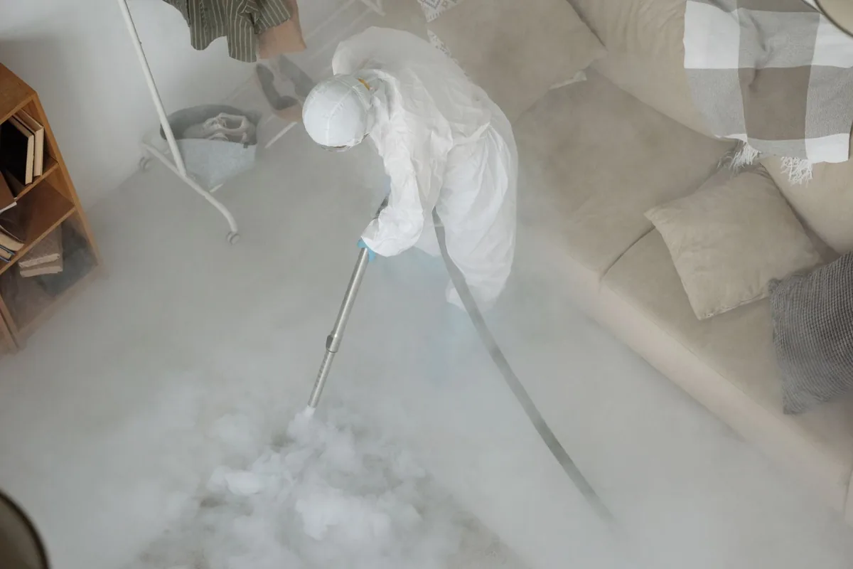Biohazard cleanup technician in protective equipment, Trumbull Center, CT